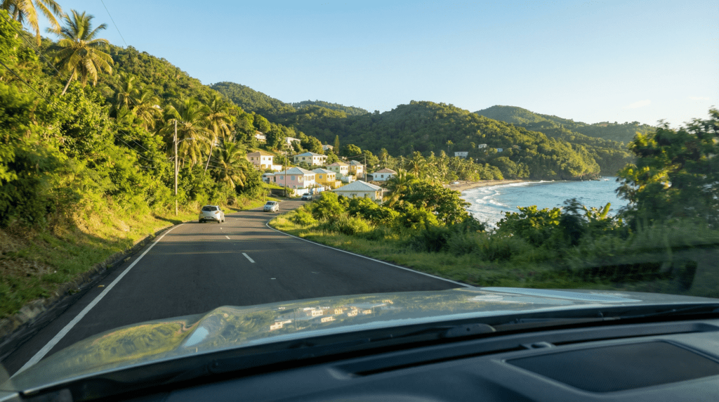 Scenic mountain road, rural villages, and quiet coastal views while driving across the island during Visit Grenada in November.