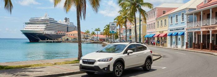 Car rental near St George’s Cruise Port in Grenada with cruise ship docked along the Carenage and rental car ready for pickup